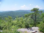 A lone pine on a rocky overlook above the Blue Ridge mountains