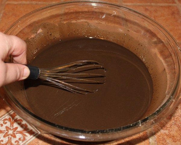 Whisking the powder and oil until smooth
